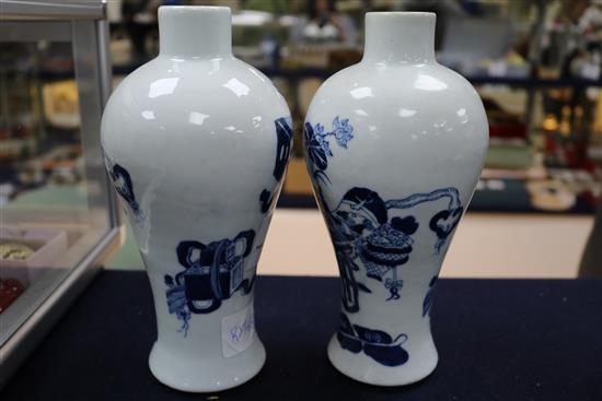 A pair of Chinese blue and white vases, wood stands